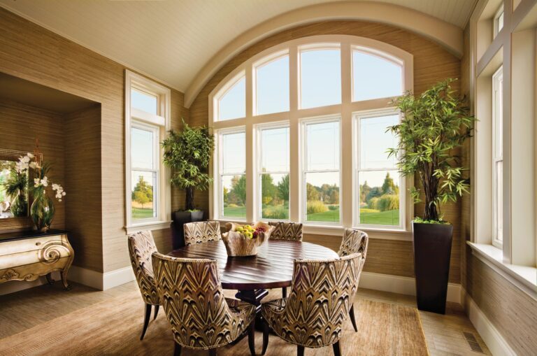 Grand arched double-hung window wall in a dining room