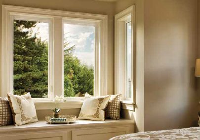Casement and awning windows in a cozy window seat nook